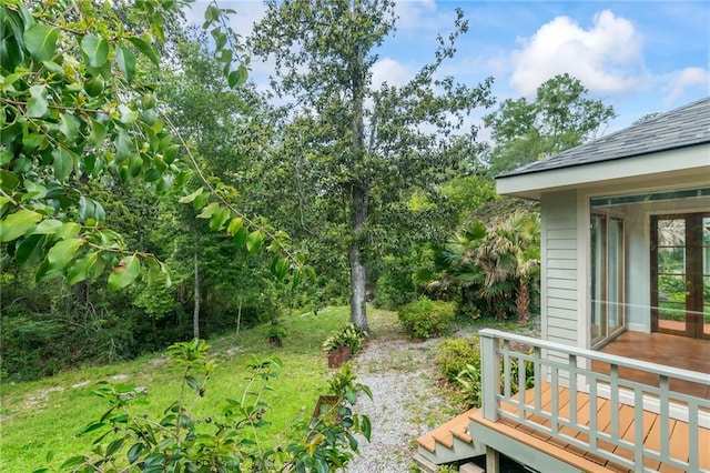 view of yard featuring a wooden deck