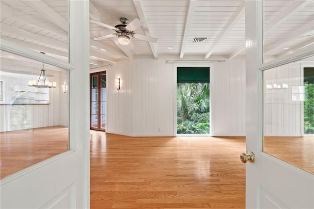 interior space with beam ceiling and light wood-type flooring