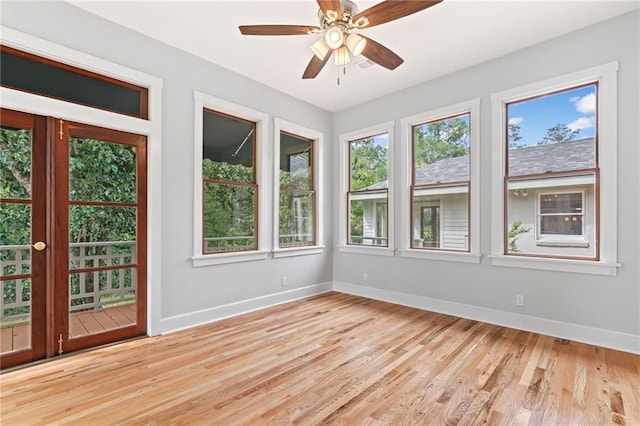 unfurnished room with light wood-type flooring and ceiling fan