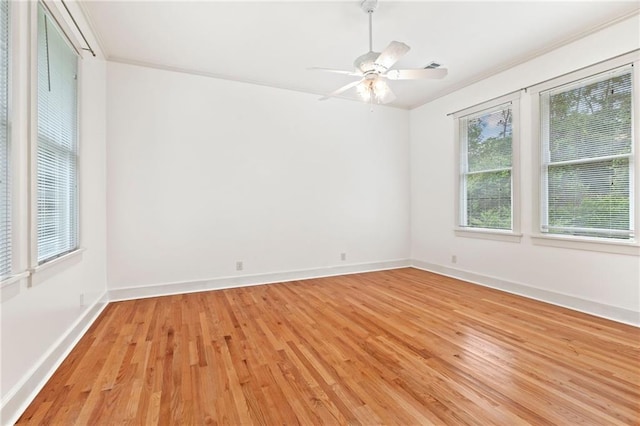 spare room featuring ceiling fan and light hardwood / wood-style floors