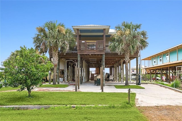 surrounding community with a yard and a carport