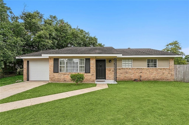 ranch-style house with a garage and a front lawn