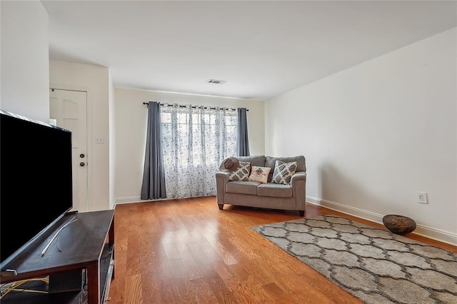 living area featuring hardwood / wood-style floors