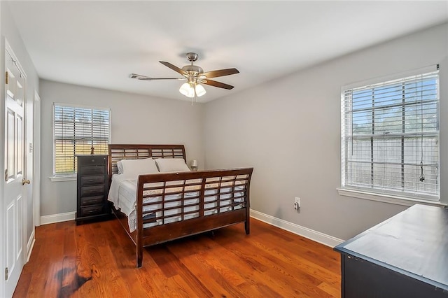 bedroom featuring dark hardwood / wood-style flooring and ceiling fan