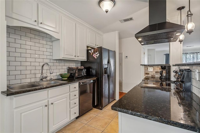 kitchen with island exhaust hood, white cabinets, tasteful backsplash, and black appliances