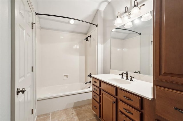 bathroom featuring vanity, shower / bath combination, and tile patterned flooring