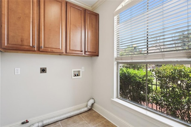 laundry room featuring cabinets, a healthy amount of sunlight, hookup for an electric dryer, and hookup for a washing machine