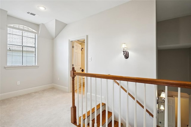 hallway with light carpet