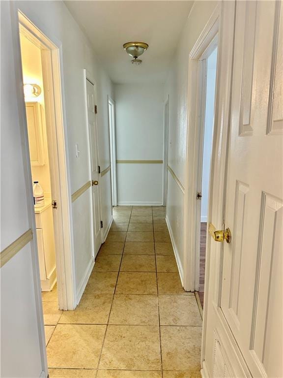 hallway with light tile patterned flooring