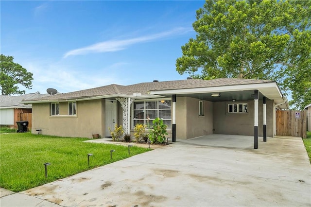 ranch-style home featuring a front yard and a carport