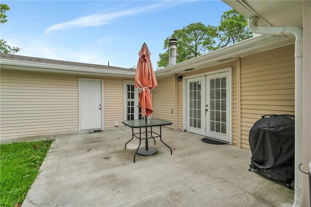 view of patio / terrace featuring french doors and a grill