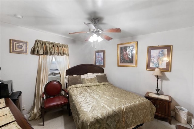 bedroom with ceiling fan and cooling unit