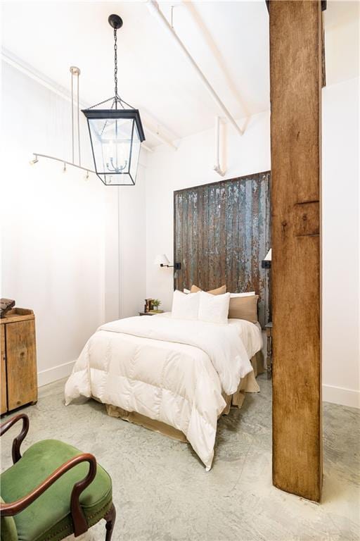 bedroom with beam ceiling