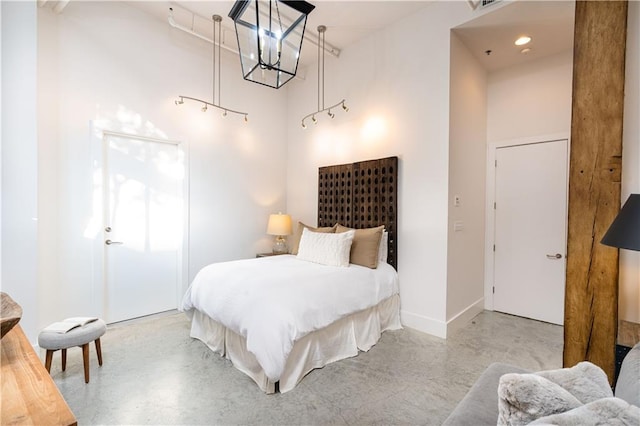 bedroom featuring a high ceiling