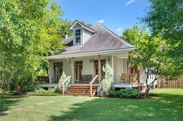 view of front facade featuring covered porch and a front yard