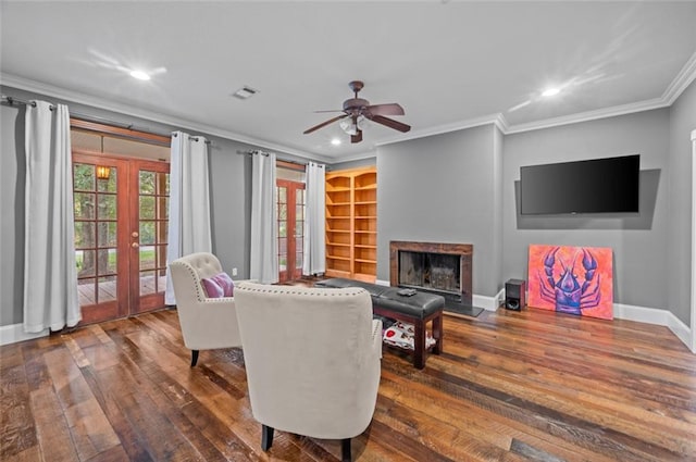 living room with crown molding, french doors, ceiling fan, and dark hardwood / wood-style floors