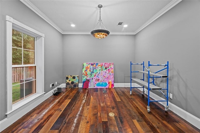 playroom with dark hardwood / wood-style floors and ornamental molding