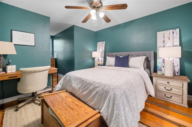 bedroom featuring ceiling fan and light hardwood / wood-style floors