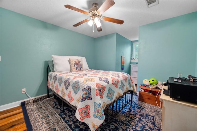 bedroom with hardwood / wood-style flooring and ceiling fan