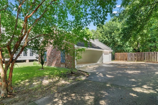 view of side of home with a lawn