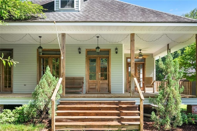 doorway to property featuring covered porch and ceiling fan