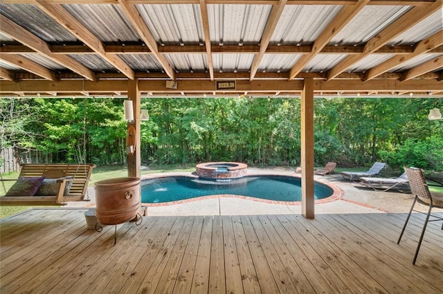 view of pool with a wooden deck and an in ground hot tub