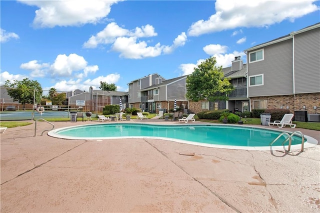 view of pool featuring central AC unit