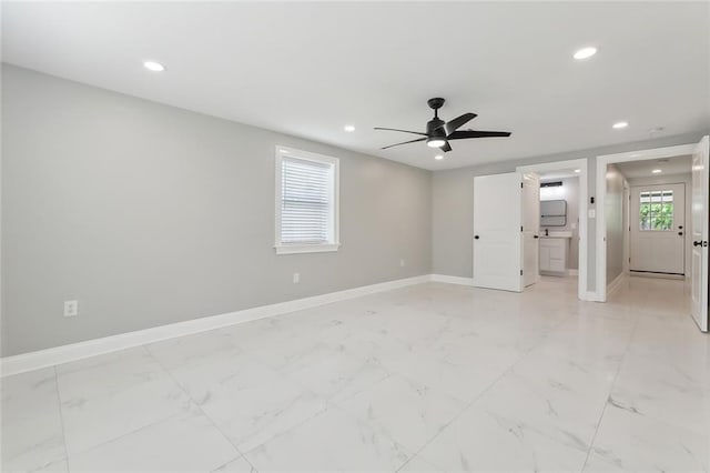 unfurnished room with ceiling fan