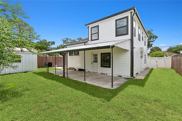 back of property with a patio and a lawn