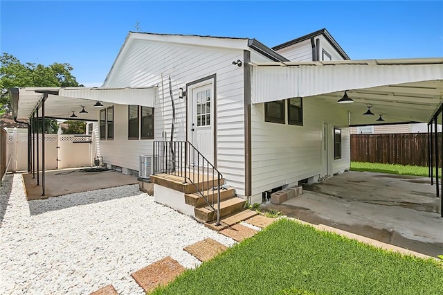 back of house featuring ceiling fan and a patio area