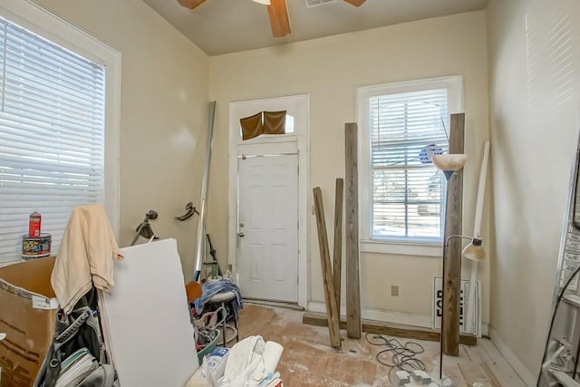 interior space with ceiling fan and plenty of natural light