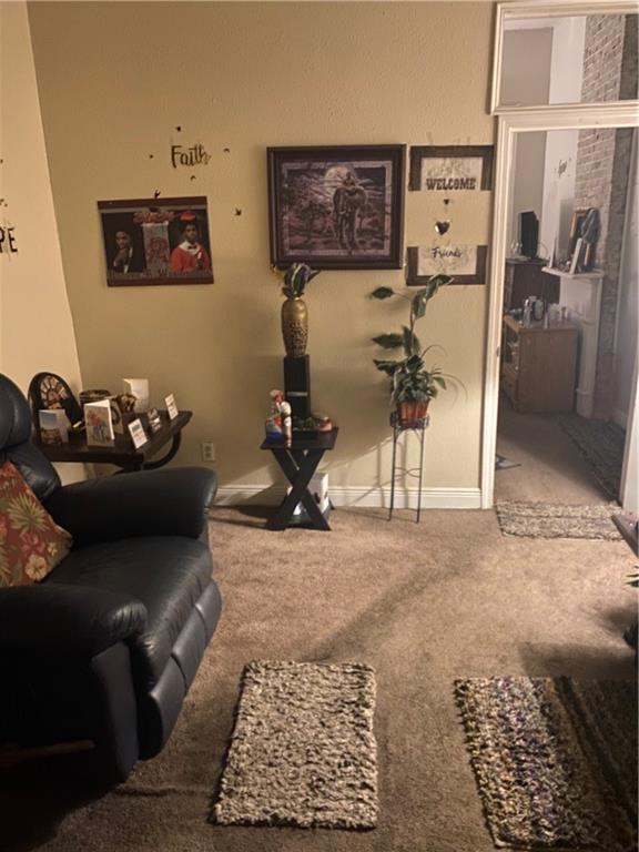 1936-1938 Franklin Ave, New Orleans, LA 70117 - carpeted living area featuring baseboards