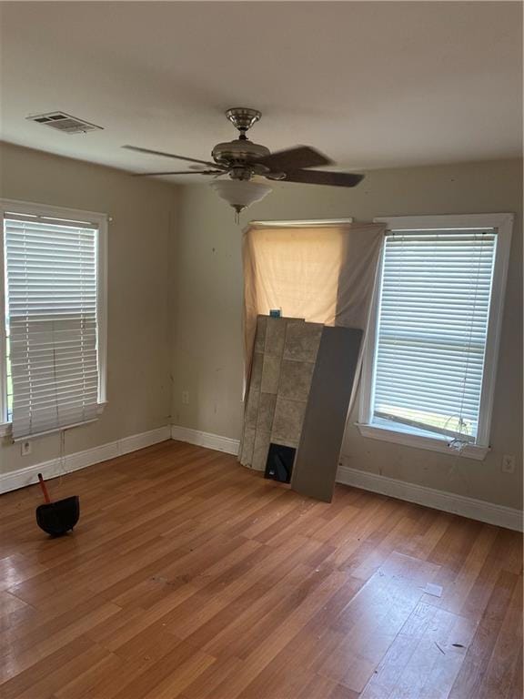 2428 Independence St, New Orleans, LA 70117 - unfurnished living room with ceiling fan and wood-type flooring