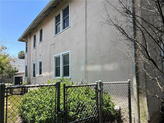 view of side of property with central AC unit