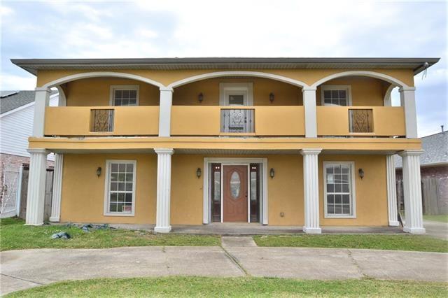 4682 Perrault Walk, New Orleans, LA 70127 - view of front of property featuring a balcony, stucco siding, and covered porch