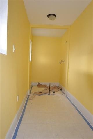 hall featuring tile patterned flooring