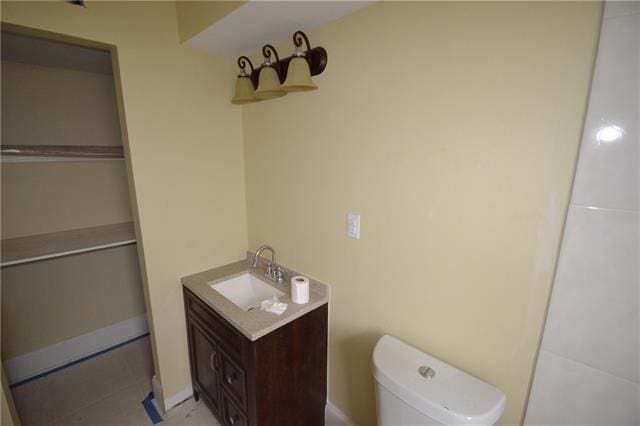 4682 Perrault Walk, New Orleans, LA 70127 - bathroom with vanity, toilet, and baseboards