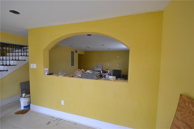 4682 Perrault Walk, New Orleans, LA 70127 - hallway featuring baseboards and arched walkways
