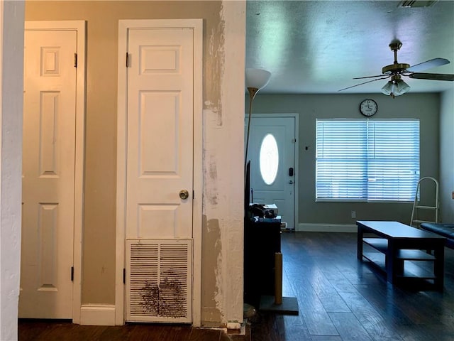 entryway with ceiling fan and dark hardwood / wood-style flooring