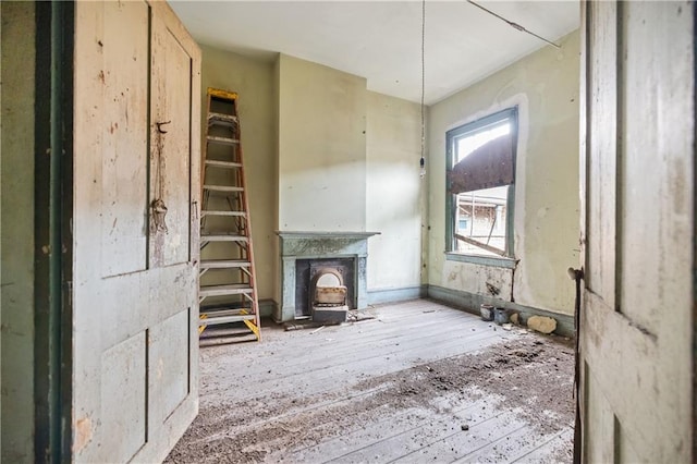 unfurnished living room with hardwood / wood-style flooring