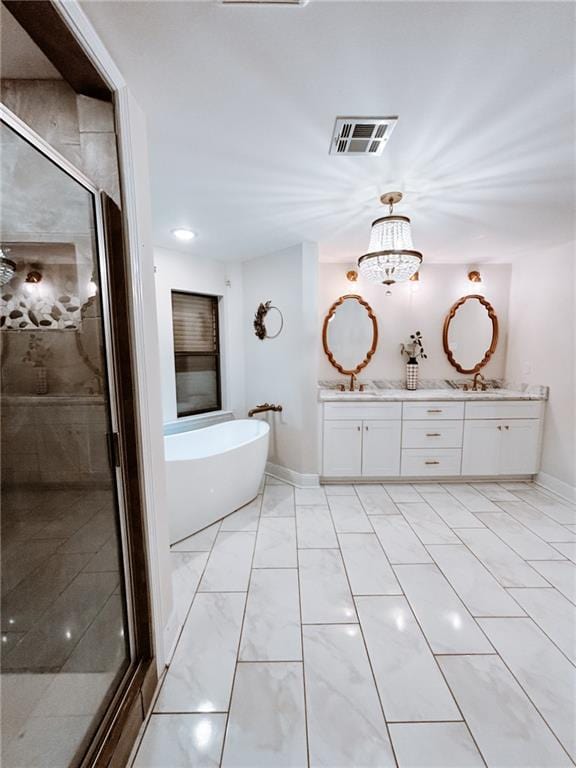 bathroom with shower with separate bathtub, dual bowl vanity, tile patterned floors, and a chandelier