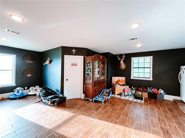 interior space featuring a wealth of natural light and wood-type flooring