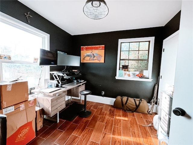 office space with wood-type flooring