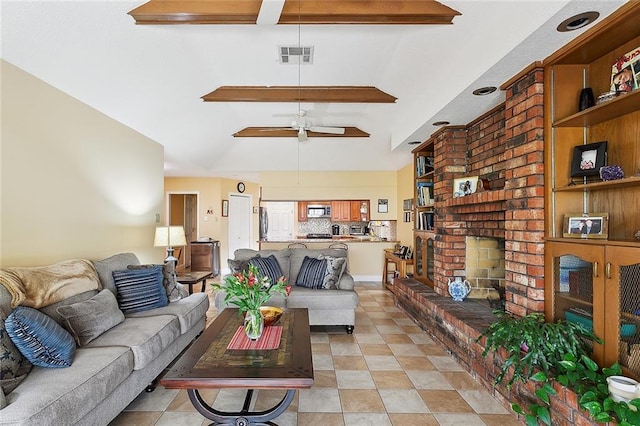 living room featuring a brick fireplace and ceiling fan