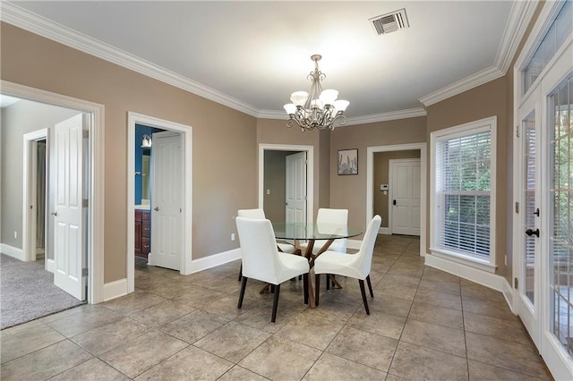 dining space featuring an inviting chandelier, ornamental molding, and light tile patterned flooring