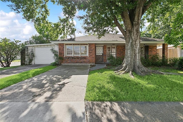 single story home with a garage and a front lawn