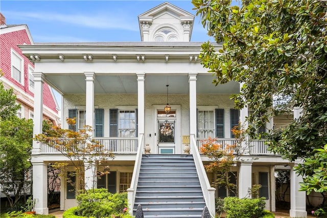 view of exterior entry with covered porch