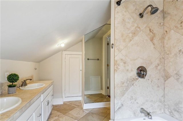 bathroom featuring tile patterned flooring, lofted ceiling, vanity, and plus walk in shower