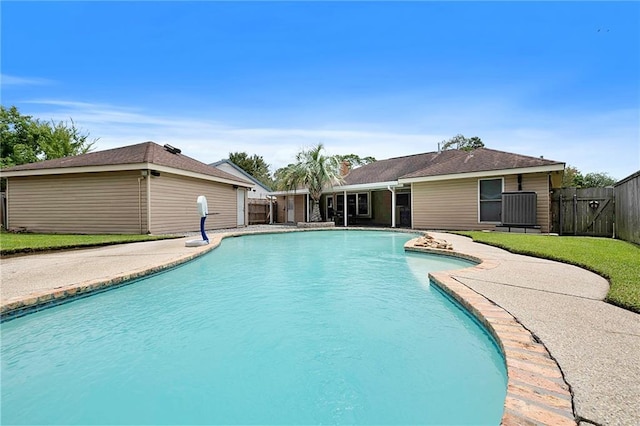 view of pool featuring a patio area and a yard