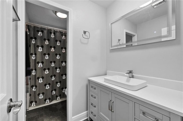 bathroom with walk in shower and vanity